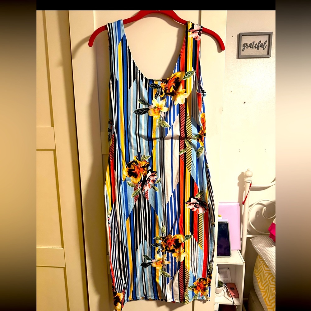 It's a summer dress multiple colors up to the knees with a few stripes.
